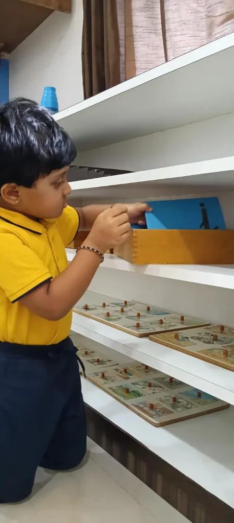 Child tracing letters at ACE Montessori, Padmanabhanagar and Jayanagar, Bangalore