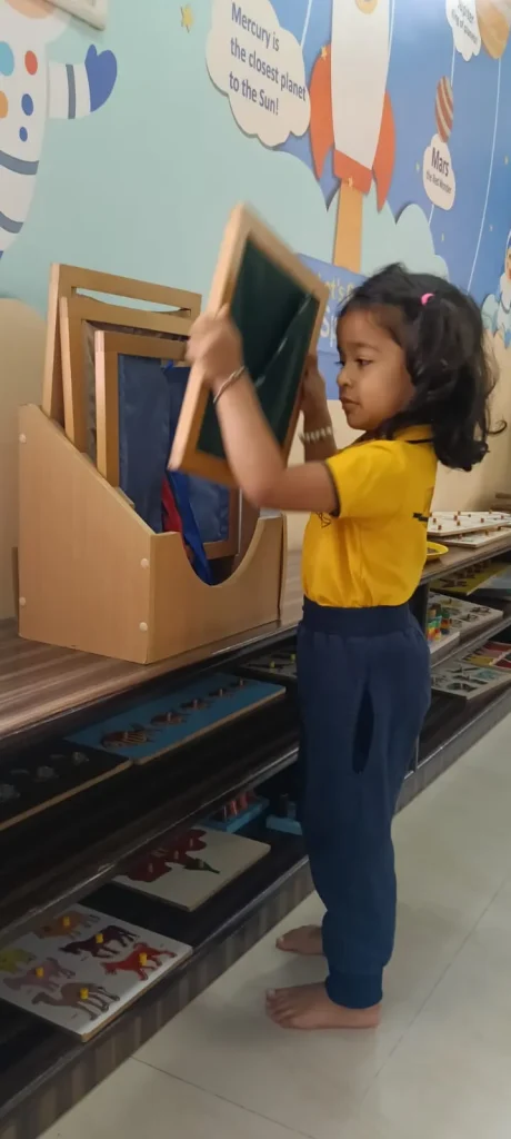 Child working with letter boards at ACE Montessori, Padmanabhanagar and Jayanagar, Bangalore