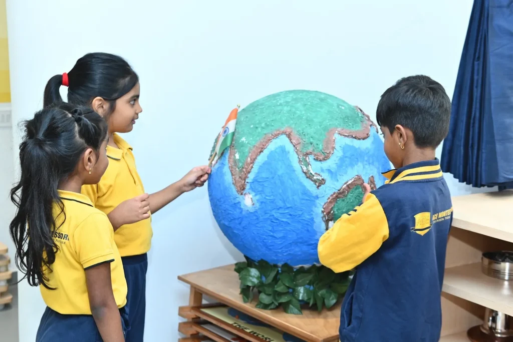 Children exploring a globe at ACE Montessori, Padmanabhanagar and Jayanagar, Bangalore