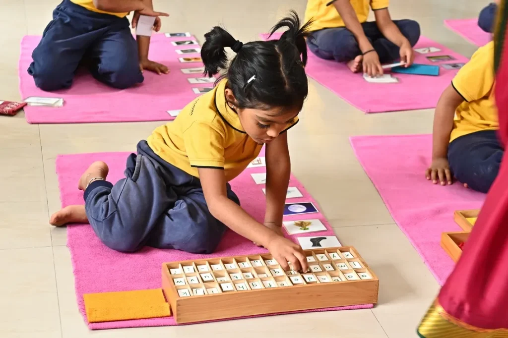 Child working with Montessori bead material at ACE Montessori, Padmanabhanagar and Jayanagar, Bangalore