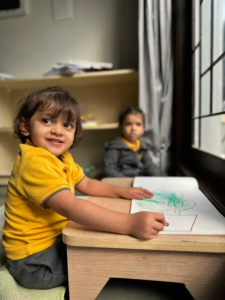 Child drawing and writing at ACE Montessori, Padmanabhanagar and Jayanagar, Bangalore