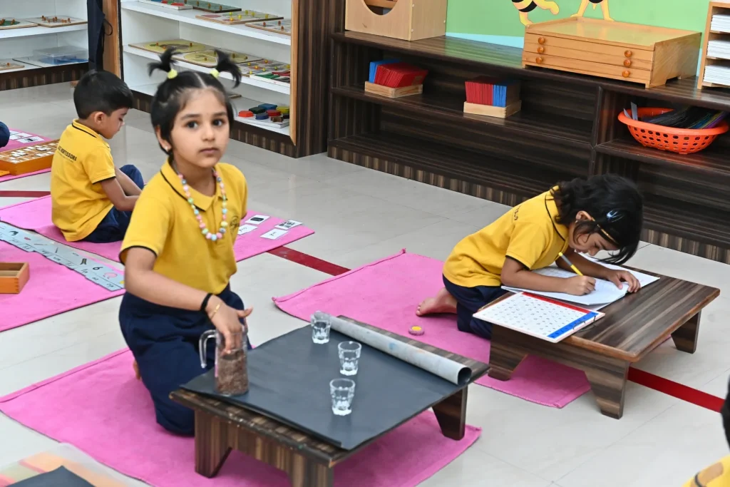 Child doing a practical life activity at ACE Montessori, Padmanabhanagar and Jayanagar, Bangalore