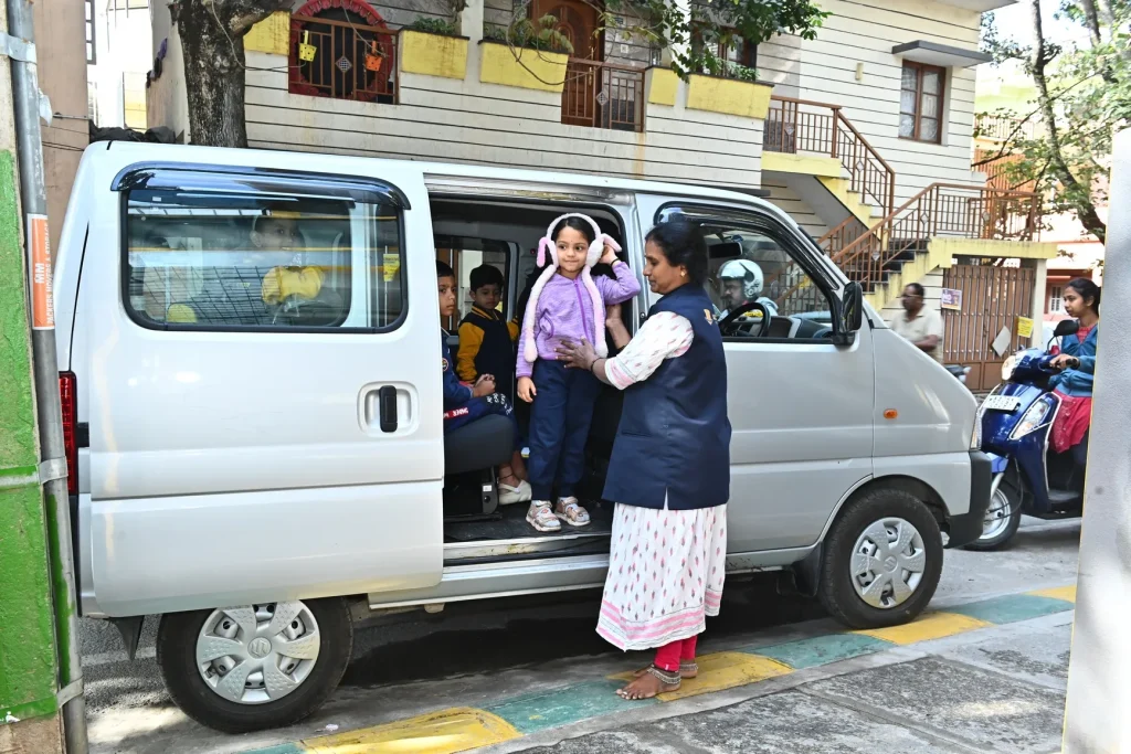 School van with female staff at ACE Montessori, Padmanabhanagar and Jayanagar, Bangalore