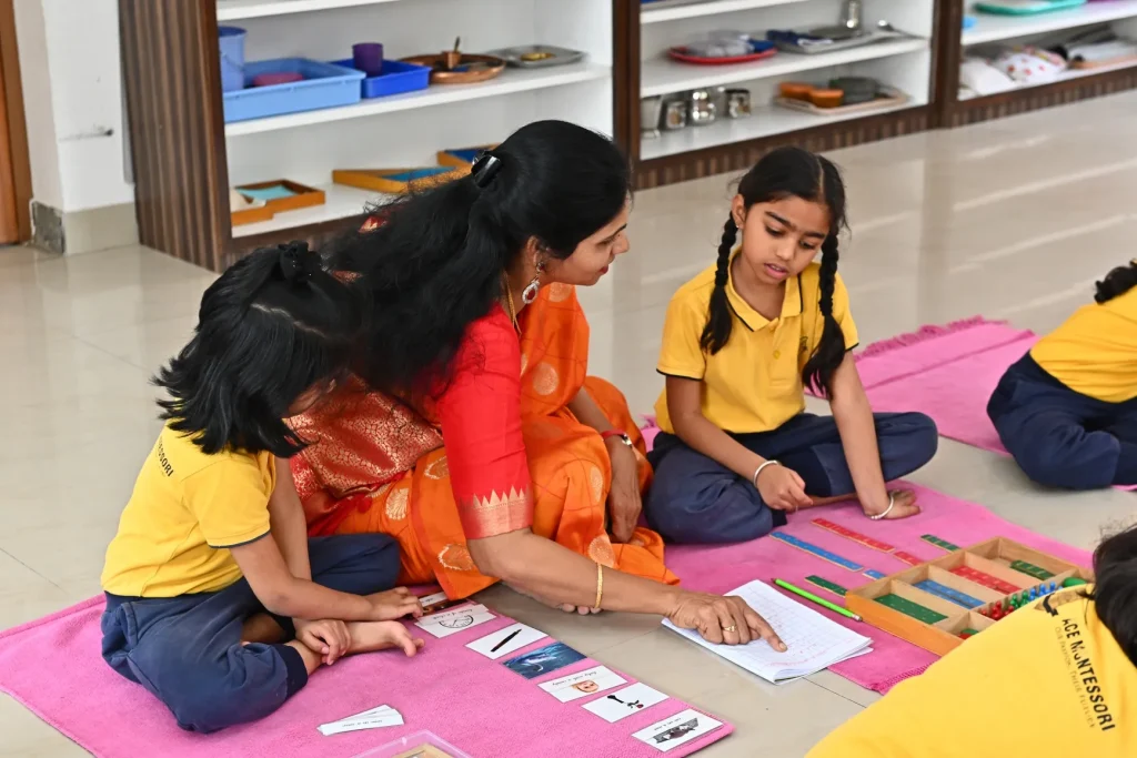Teacher guiding Montessori children at ACE Montessori, Padmanabhanagar and Jayanagar, Bangalore