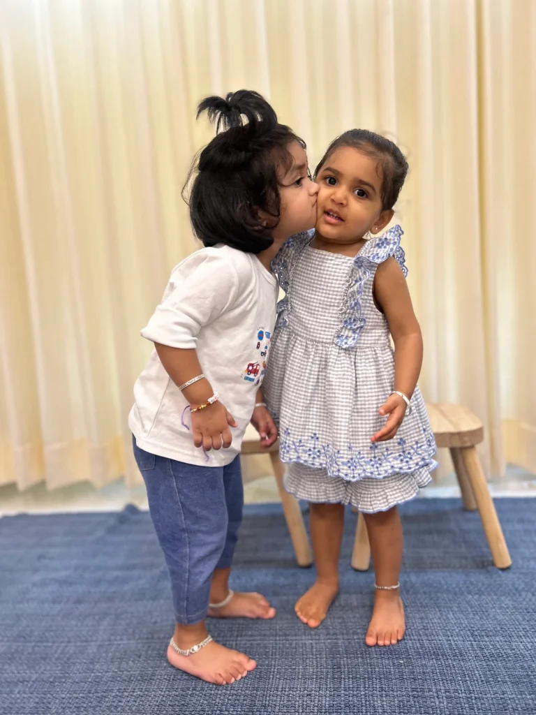 Girls sharing a happy moment at ACE Montessori, Jayanagar, Bangalore