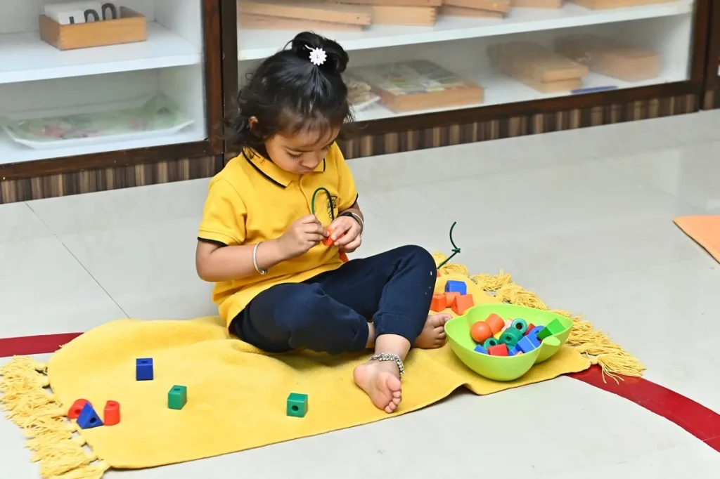 Child on a Montessori mat at our Montessori school in Padmanabhanagar, Bengaluru